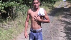 Hunky stud jerks off his dick outdoors Thumb