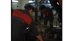 Horny brunette babe fucked by two mechanic guys ! Thumb