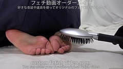 Tickle the soles of women'_s feet with a fork and a hairbrush. Thumb