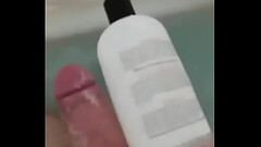 HUNGarian Big DICK measuring against family sized shampoo jug Thumb