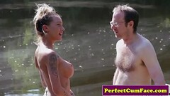 Busty femdom tugging guy outdoors for spunk Thumb